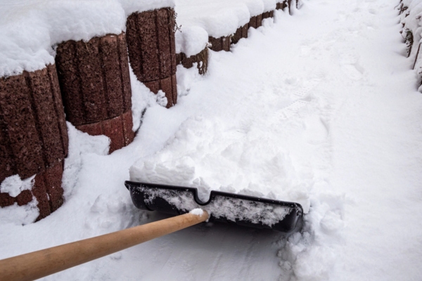 snow shoveling outside the house