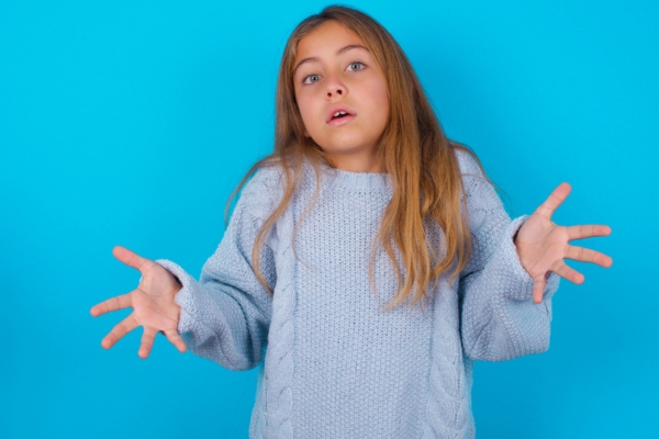 young girl shrugging depicting What to Do if Snow Has Already Covered Your Generator