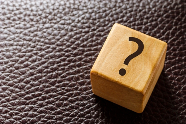 question mark on a wooden cube depicting Air Conditioning Scams FAQs