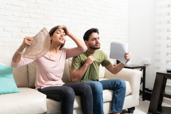 couple feeling warm indoors due to AC problems