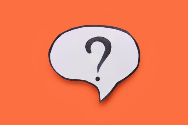 question mark on a paper speech bubble cutout depicting Heating Oil vs Electric Heat FAQs